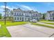 Beautiful townhomes with well-manicured lawns, driveways, and modern exteriors at 184 Kirkland St, Goose Creek, SC 29445