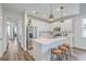 Modern kitchen features white cabinetry, stainless steel appliances, and center island with seating at 184 Kirkland St, Goose Creek, SC 29445