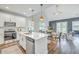 Open-concept kitchen with stainless steel appliances flows into dining area with ample seating at 184 Kirkland St, Goose Creek, SC 29445