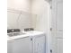 Laundry room features a washer, dryer, and shelving for easy laundry organization and storage at 184 Kirkland St, Goose Creek, SC 29445