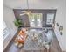 Bright living room offers high ceilings, modern decor, comfortable seating and backyard views at 184 Kirkland St, Goose Creek, SC 29445