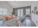Cozy living room with stylish furniture, including sofa, chairs, and ceiling fan at 184 Kirkland St, Goose Creek, SC 29445