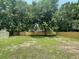 Expansive backyard featuring a new wooden fence with mature trees lining the perimeter at 2 Clarksville Ln, Goose Creek, SC 29445