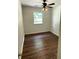 This cozy bedroom boasts stylish hardwood floors and a modern ceiling fan with integrated lighting at 2 Clarksville Ln, Goose Creek, SC 29445