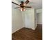 Bedroom features wood floors, a ceiling fan, and closet space for convenient storage solutions at 2 Clarksville Ln, Goose Creek, SC 29445