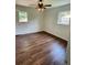 Bedroom with wood-look floors and lots of natural light through two windows at 2 Clarksville Ln, Goose Creek, SC 29445