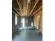 Spacious garage featuring unfinished walls, a dark floor, and ample room for storage or a workshop at 2 Clarksville Ln, Goose Creek, SC 29445
