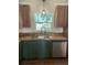 Close up of kitchen sink and stainless steel appliances with wood cabinets at 2 Clarksville Ln, Goose Creek, SC 29445