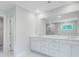 Bright bathroom features a double vanity with modern fixtures and a large mirror at 2018 Quiet Ibis Rd, Hanahan, SC 29410