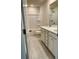Well-lit bathroom with tile floors, white cabinets, double sinks, and tub/shower combo at 2018 Quiet Ibis Rd, Hanahan, SC 29410