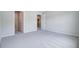 Bright bedroom featuring neutral walls, carpet, and walk-in closets at 2018 Quiet Ibis Rd, Hanahan, SC 29410
