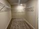 Walk-in closet with neutral carpet, wire shelving and ample space for storage and organization at 2018 Quiet Ibis Rd, Hanahan, SC 29410