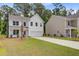 Two-story home with a well-maintained front lawn and a two-car garage at 2018 Quiet Ibis Rd, Hanahan, SC 29410
