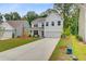 Beautiful two-story home with a long driveway and well-manicured lawn at 2018 Quiet Ibis Rd, Hanahan, SC 29410