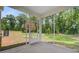 Screened porch with views of a lush backyard at 2018 Quiet Ibis Rd, Hanahan, SC 29410
