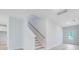 Bright entryway featuring a staircase with a white banister and wood handrail at 2018 Quiet Ibis Rd, Hanahan, SC 29410