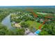 Stunning aerial showcases neighborhood with HOA pool, a serene lake and a home at 2031 Thornhill Dr, Summerville, SC 29485