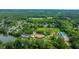 Gorgeous aerial view of neighborhood with lake access and community pool surrounded by lush greenery at 2031 Thornhill Dr, Summerville, SC 29485