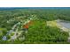 An aerial view shows the neighborhood with the tree-lined streets and sidewalks at 2031 Thornhill Dr, Summerville, SC 29485