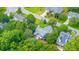 An aerial view shows the home with a private, fenced backyard and solar panels at 2031 Thornhill Dr, Summerville, SC 29485