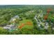 An aerial view shows the neighborhood with the pool, tennis courts, and other HOA-provided amenities at 2031 Thornhill Dr, Summerville, SC 29485