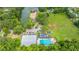 Aerial view showcases community with pool and lake access amid lush greenery at 2031 Thornhill Dr, Summerville, SC 29485
