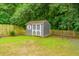 The outdoor shed provides ample storage, complementing the fenced-in yard and green space at 2031 Thornhill Dr, Summerville, SC 29485