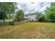 A quaint picket fence surrounds the landscaped backyard, perfect for outdoor activities and relaxation at 2031 Thornhill Dr, Summerville, SC 29485
