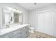 Bright bathroom with double vanity, tile floors, and a glass-enclosed shower at 2031 Thornhill Dr, Summerville, SC 29485