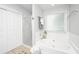 A bright bathroom with a soaking tub and a glass enclosed shower at 2031 Thornhill Dr, Summerville, SC 29485