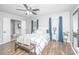 This bedroom includes hardwood floors, neutral paint, natural light, and an ensuite bathroom at 2031 Thornhill Dr, Summerville, SC 29485