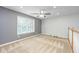 A bonus room offers ample natural light from the large window and ceiling fan at 2031 Thornhill Dr, Summerville, SC 29485
