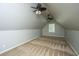 Upstairs bonus room featuring carpeting, a window, vaulted ceilings, and two ceiling fans at 2031 Thornhill Dr, Summerville, SC 29485