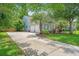 The home features an attached two-car garage and a long driveway at 2031 Thornhill Dr, Summerville, SC 29485