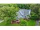 Striking aerial view highlights a home with lush landscaping and mature trees in a quiet neighborhood at 2031 Thornhill Dr, Summerville, SC 29485