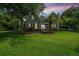 Charming two-story home with lush landscaping, mature trees, and beautiful lawn at 2031 Thornhill Dr, Summerville, SC 29485
