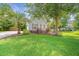 Charming home with beautiful landscaping, mature trees, and a well-maintained lawn and driveway at 2031 Thornhill Dr, Summerville, SC 29485