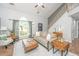 Inviting living room with large windows, staircase, and stylish furnishings at 2031 Thornhill Dr, Summerville, SC 29485