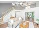 Open concept living room with high ceilings, a staircase, and ample natural light at 2031 Thornhill Dr, Summerville, SC 29485