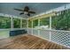 A screened in back porch includes string lights, and a porch swing at 2031 Thornhill Dr, Summerville, SC 29485