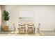 Inviting dining room with beach-themed art and a natural wood table setting for six at 205 Agrarian Ave, Summerville, SC 29485