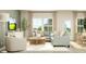 Bright and airy living room featuring a corner sofa, stylish decor, and an inviting atmosphere at 205 Agrarian Ave, Summerville, SC 29485