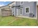 A backyard with a small patio, providing a cozy outdoor space for entertaining or relaxing at 208 Kirkland St, Goose Creek, SC 29445