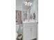 Bathroom featuring a single sink vanity with chrome fixtures and a framed mirror at 208 Kirkland St, Goose Creek, SC 29445