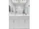 Bathroom featuring a double sink vanity with chrome fixtures and a large mirror at 208 Kirkland St, Goose Creek, SC 29445