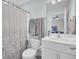 Bathroom featuring a single sink vanity with chrome fixtures and a framed mirror at 208 Kirkland St, Goose Creek, SC 29445