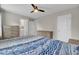 Bedroom features a neutral palette and ceiling fan, with an ensuite bathroom at 208 Kirkland St, Goose Creek, SC 29445