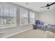 Bright bedroom with three windows, neutral walls, and a daybed at 208 Kirkland St, Goose Creek, SC 29445