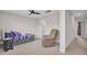 Spacious bedroom with daybed, recliner chair, and hallway access at 208 Kirkland St, Goose Creek, SC 29445