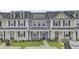 Charming townhome with a well-manicured lawn and covered front porch, perfect for relaxing outdoors at 208 Kirkland St, Goose Creek, SC 29445